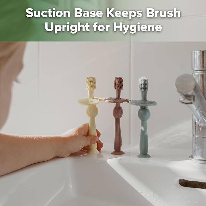 haakaa 360° Baby Toothbrush with Suction Base - Gentle Cleaning for Infant Self-Brushing Training, Food-Grade Silicone, Adjustable Safety Shield - Cream (1 Piece)